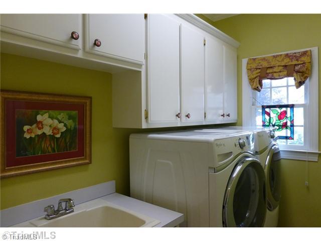 307 Georgetowne Drive Elon, NC 27244 - Photo 9 of 16 Laundry Room. Laundry room off kitchen/garage entry with utility sink