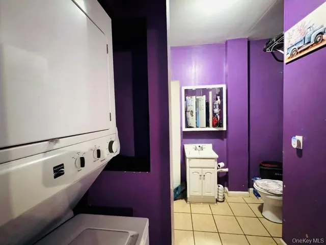 a bedroom with a bed and a ceiling fan