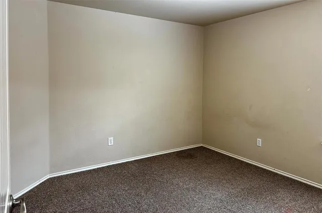 an empty room with a bench