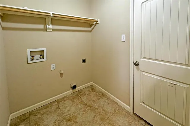 a front view of a house with a garden and yard