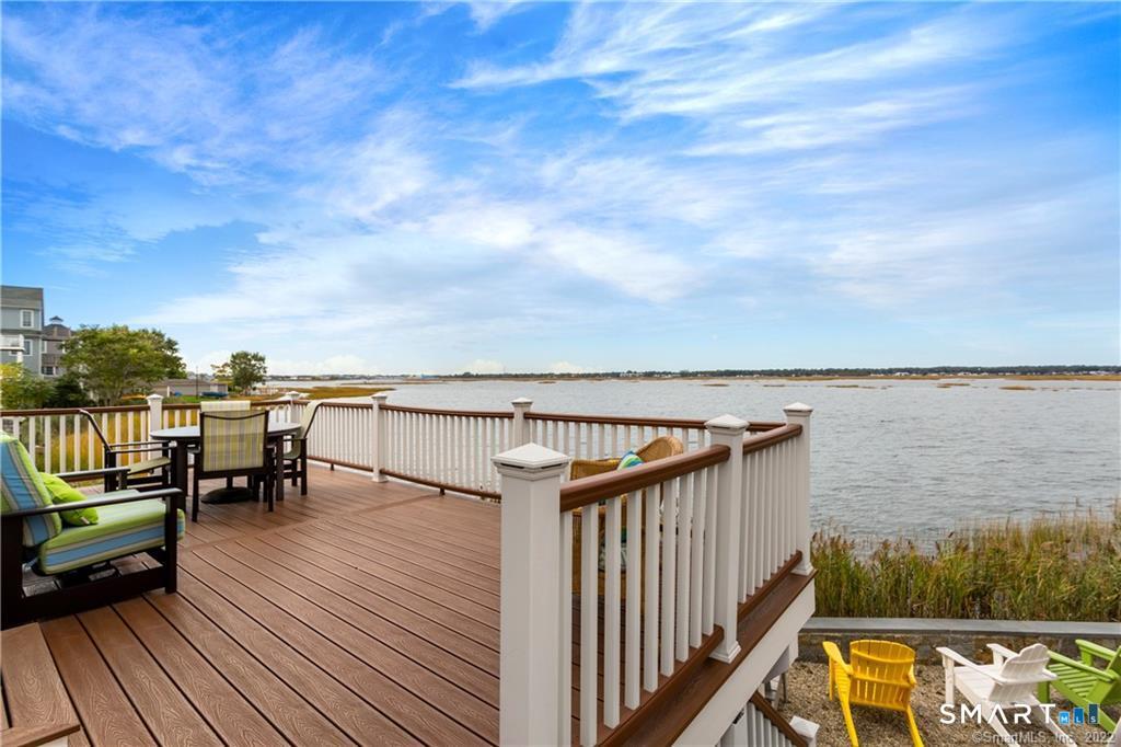 50 Milford Point Road Milford, CT 06460 - Photo 3 of 6 a balcony with wooden floor with outdoor seating