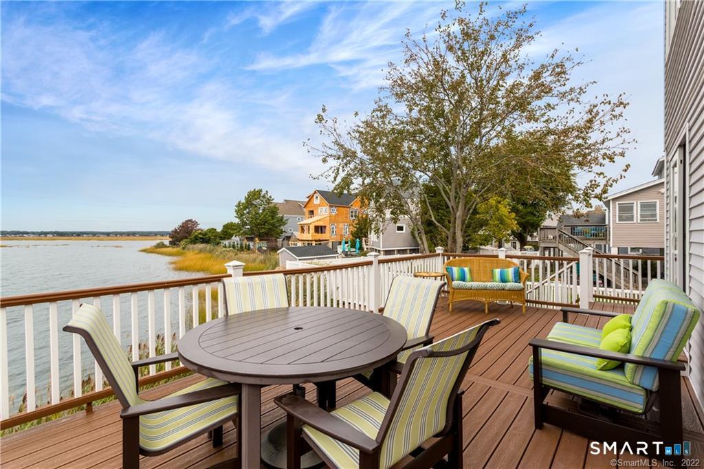 50 Milford Point Road Milford, CT 06460 - Photo 4 of 6 a view of a chairs and table on the roof deck