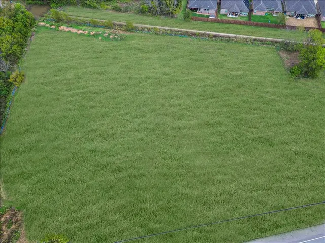 a view of a field with clear sky