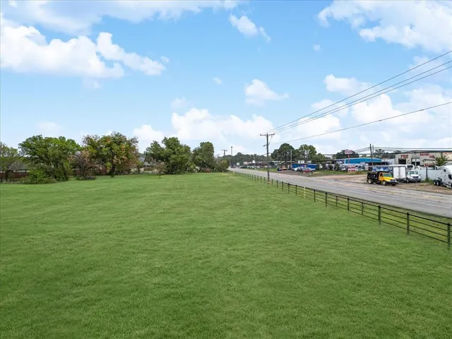 a view of a water fountain and a big yard