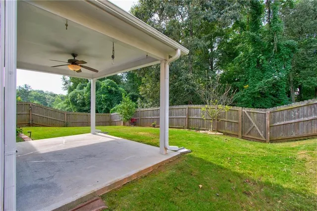a view of a backyard with in front of a house