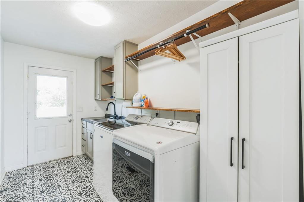 500 Coleman Mill Road Carrollton, GA 30116 - Photo 16 of 83 a utility room with a sink washer and dryer