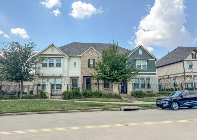 a view of a parked cars in front of a house