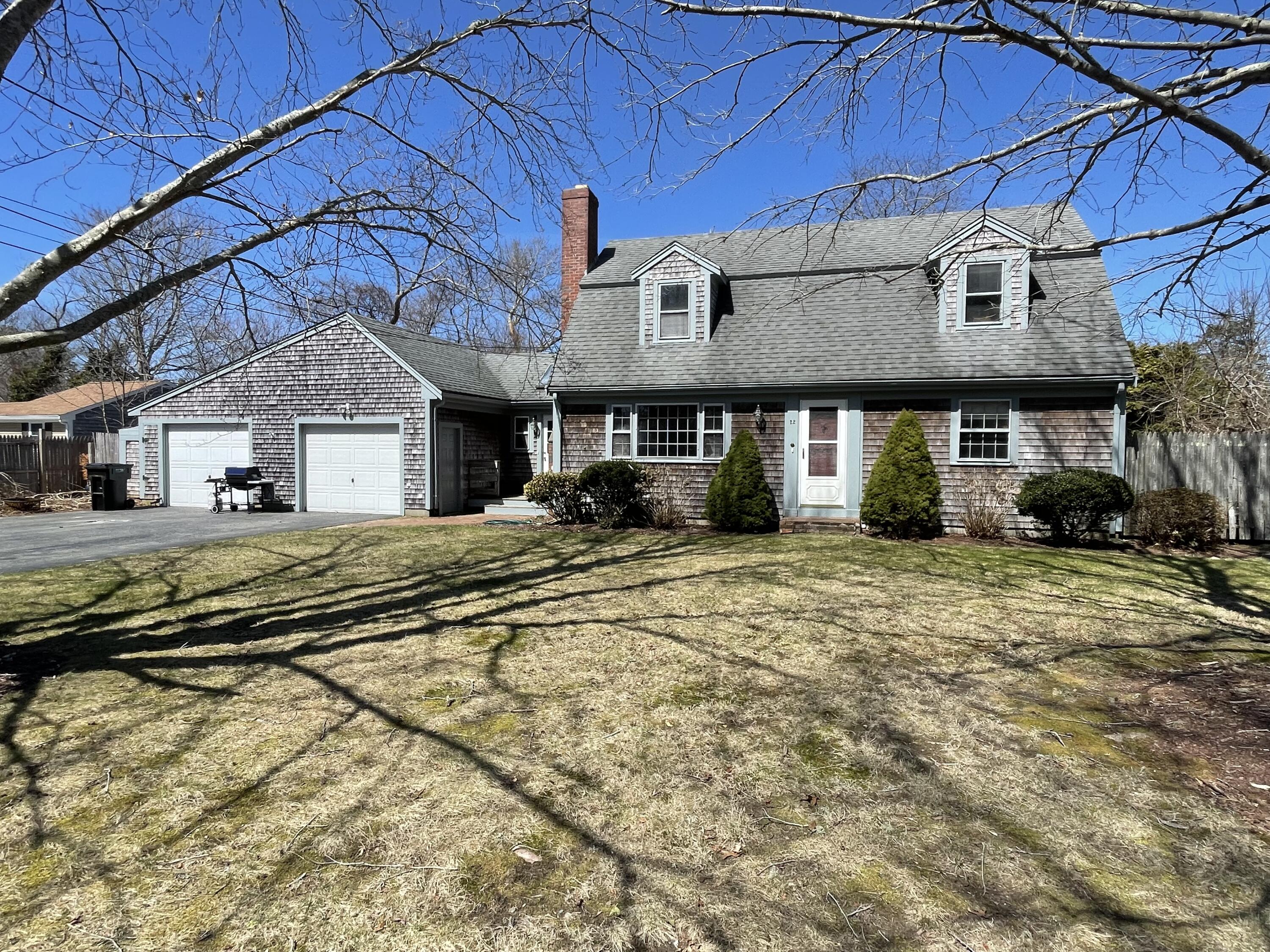 22 Winsome Road South Yarmouth, MA 02664 - Photo 2 of 30 a front view of a house with a yard