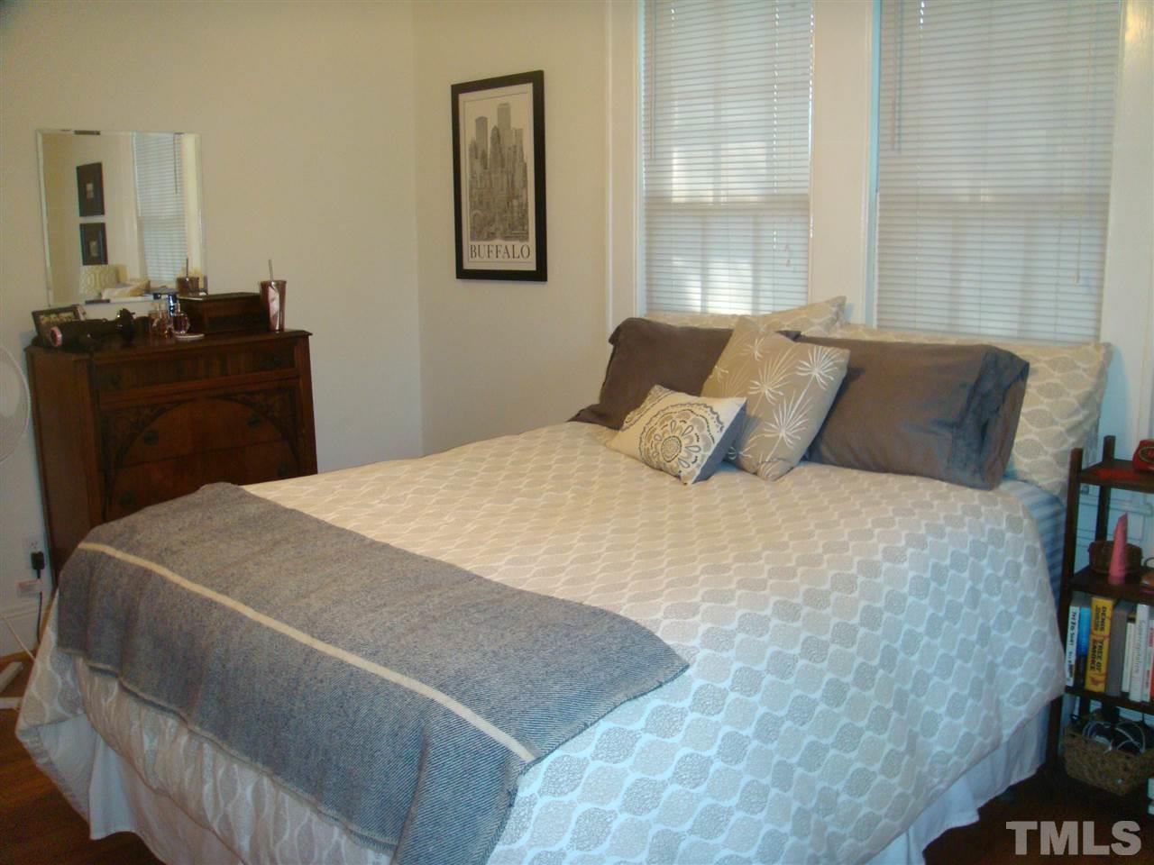 1225 Old Wake Forest Road Raleigh, NC 27604 - Photo 7 of 11 a bedroom with a bed and dresser