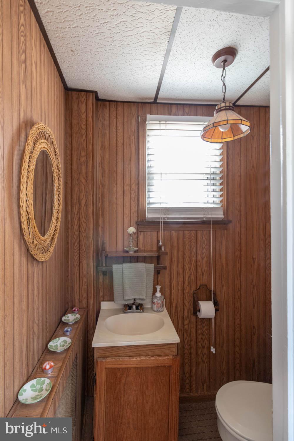 412 Oxford Road Havertown, PA 19083 - Photo 18 of 30 a bathroom with a toilet a sink and a window