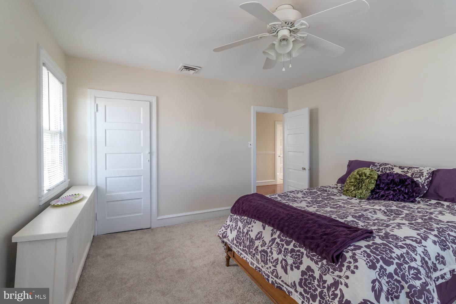 412 Oxford Road Havertown, PA 19083 - Photo 22 of 30 a bedroom with a large bed and a chandelier