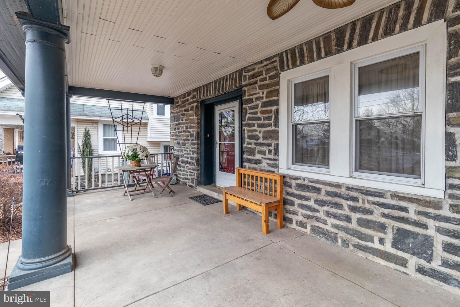 412 Oxford Road Havertown, PA 19083 - Photo 6 of 30 a view of a porch with chairs and backyard of the house
