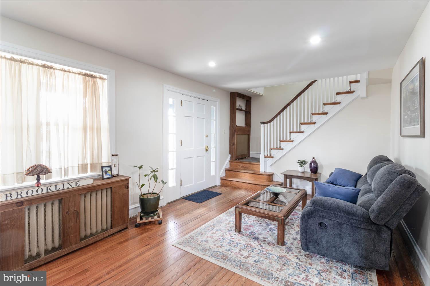 412 Oxford Road Havertown, PA 19083 - Photo 8 of 30 a living room with furniture wooden floor and a large window