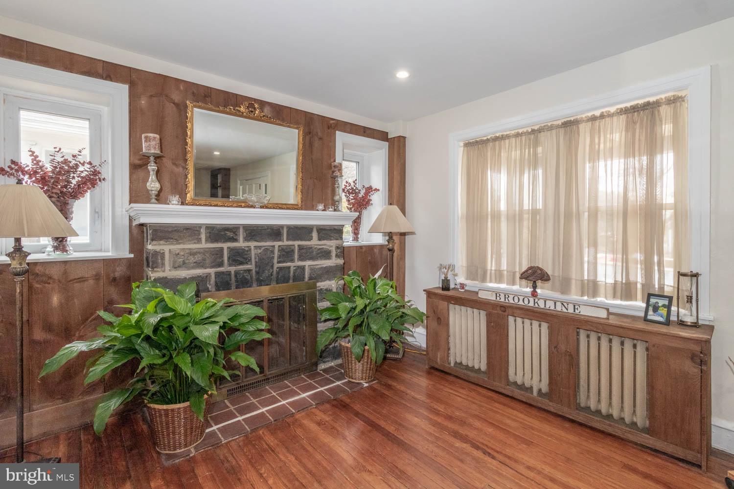 412 Oxford Road Havertown, PA 19083 - Photo 10 of 30 a view of hall with wooden floor and a potted plant