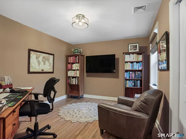 a living room with furniture or couch and a flat screen tv