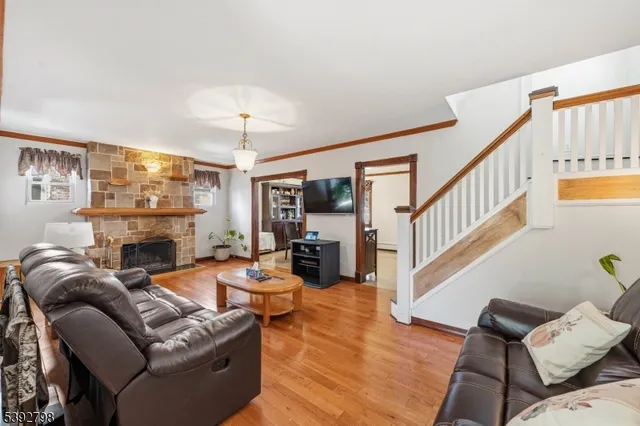 a living room with fireplace furniture and a flat screen tv