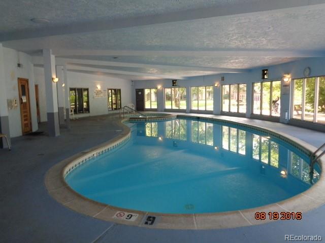 1306 South Parker Road, Unit 167 Denver, CO 80231 - Photo 23 of 26 a view of a swimming pool with an outdoor seating