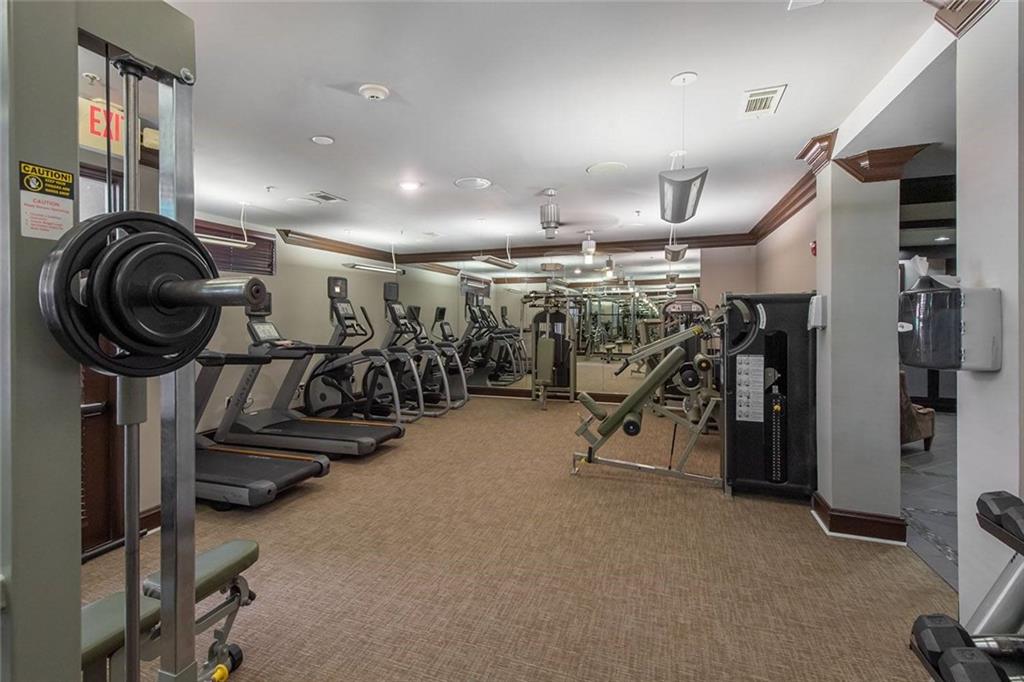 3443 Kingsboro Road Northeast, Unit 1202 Atlanta, GA 30326 - Photo 14 of 17 a view of a room with gym equipment