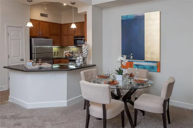 a dining room with furniture and wooden floor