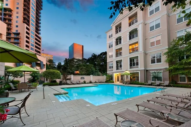 a view of pool with outdoor seating