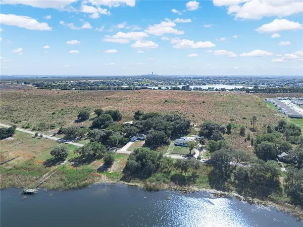 an aerial view of a houses with outdoor space