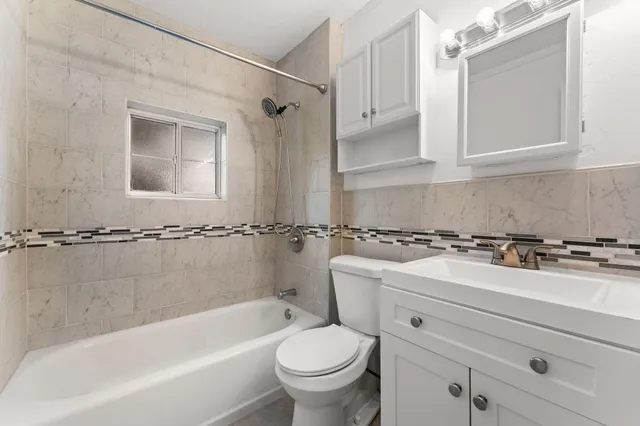 a bathroom with a sink a toilet and a bathtub