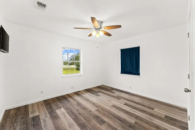a view of room window and ceiling fan