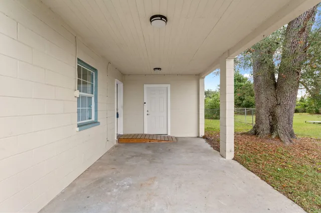 a view of an empty room with a balcony