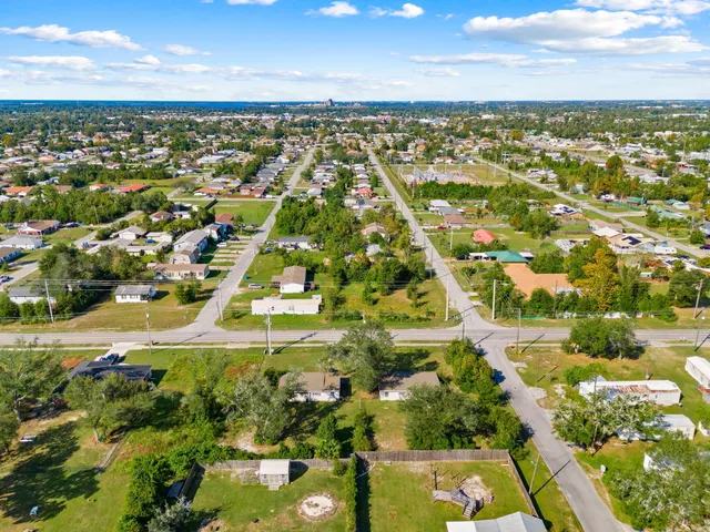 an aerial view of residential houses with outdoor space