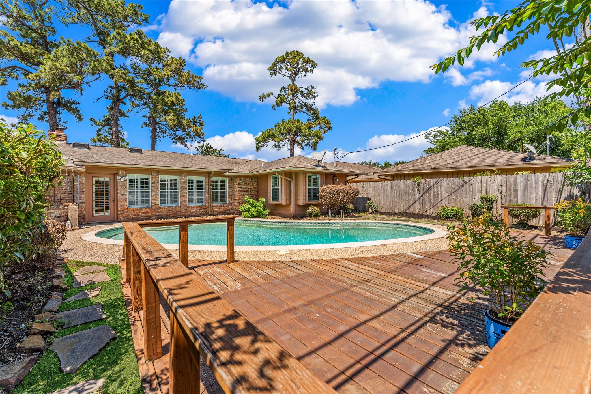 983 West Donovan Street Houston, TX 77091 - Photo 45 of 46 Backyard view showcasing the sundeck overlooking the pool ready for summer tanning. Be sure to bring your sunscreen!!