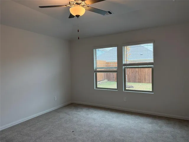 a view of an empty room with a fireplace
