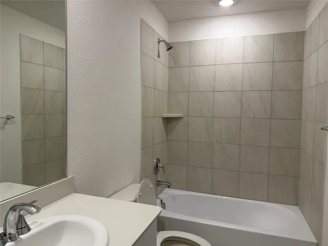 a bathroom with a sink and a bathtub