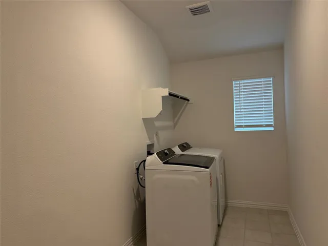 a kitchen with stainless steel appliances a stove a sink and a microwave