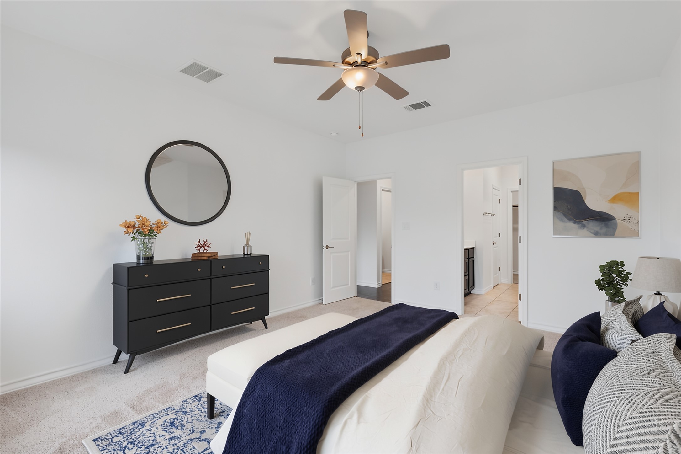 104 Stinchcomb Road Hutto, TX 78634 - Photo 16 of 40
The private primary suite offers more greenbelt views, an en suite bath with dual vanities, a walk-in shower, and a spacious walk-in closet.