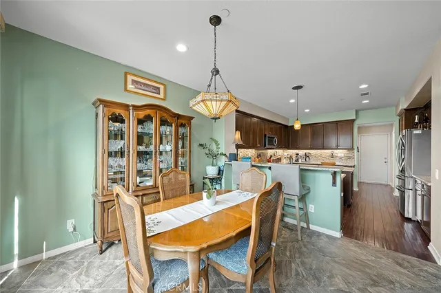 a dining room filled with furniture and window
