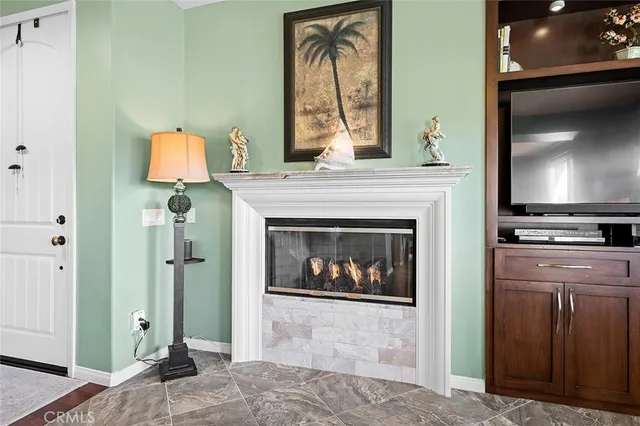 a work room with furniture and a flat screen tv