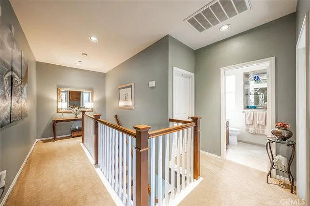 a livingroom with workspace and a couch