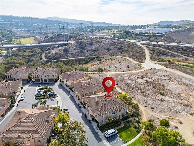 an aerial view of a house with a ocean view