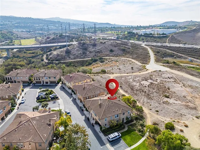 an aerial view of a house with a ocean view