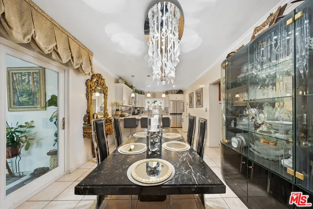 a very nice looking dining room with a table and chairs