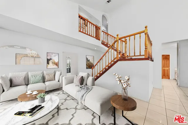 a living room with furniture and a rug