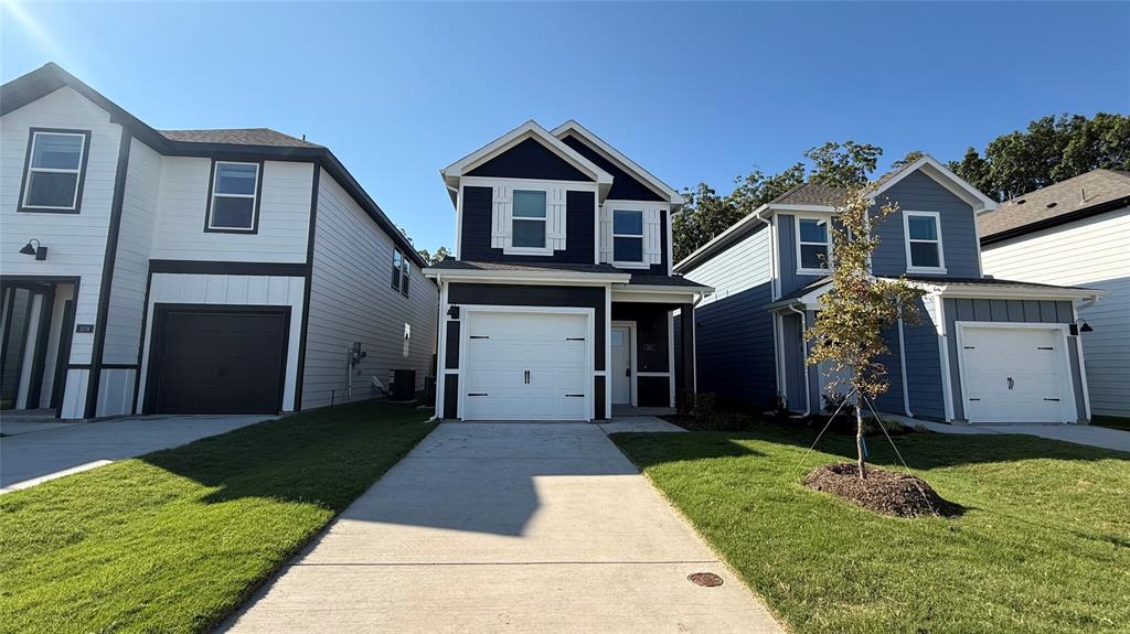 311 Clematis Street Princeton, TX 75407 - Photo 1 of 20 a front view of a house with a yard and garage