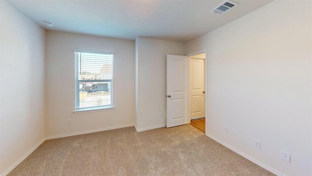 311 Clematis Street Princeton, TX 75407 - Photo 11 of 20 an empty room with windows