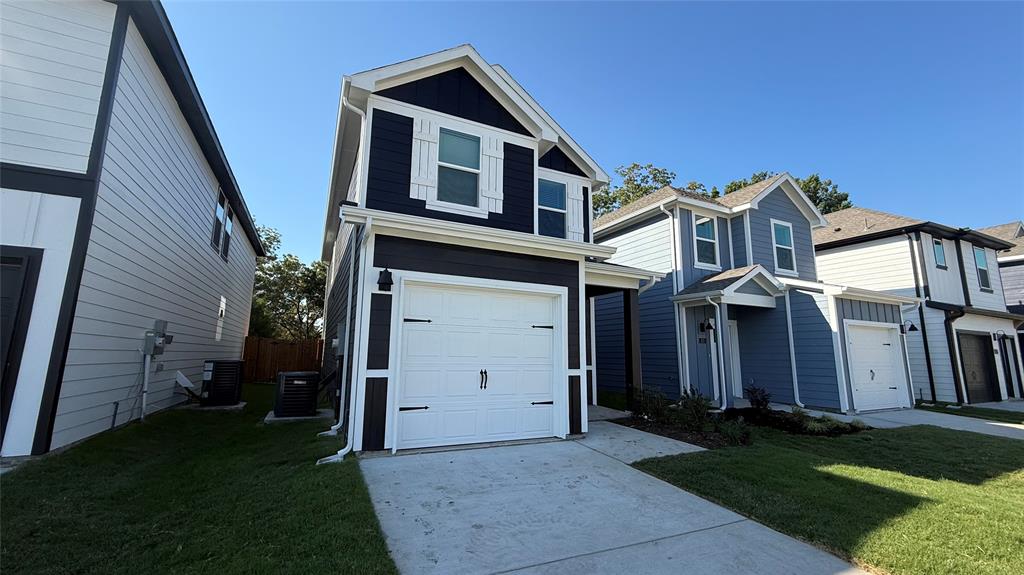 311 Clematis Street Princeton, TX 75407 - Photo 2 of 20 a front view of a house with a yard