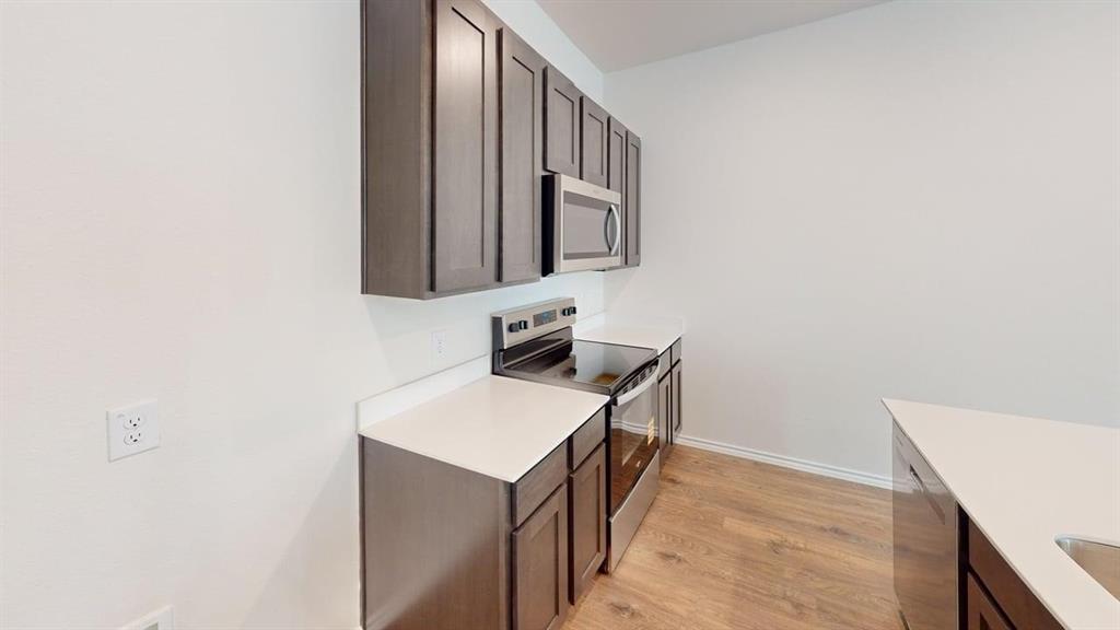 311 Clematis Street Princeton, TX 75407 - Photo 5 of 20 a bathroom with a sink a vanity and a mirror