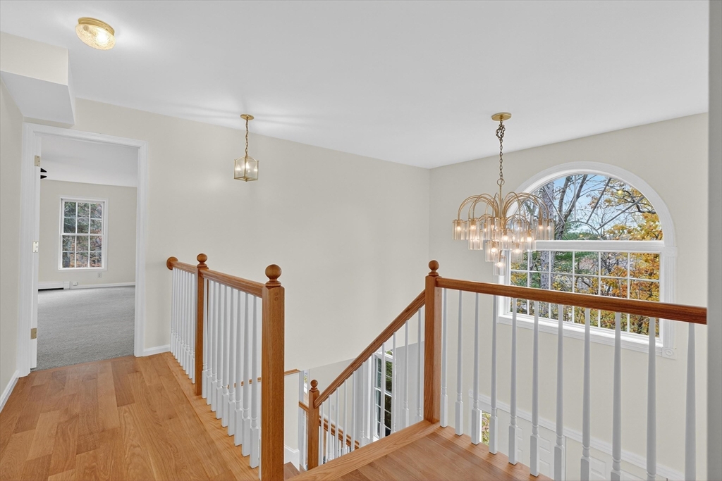 14 Pine Hill Road Framingham, MA 01701 - Photo 21 of 42 a view of staircase with railing and chandelier