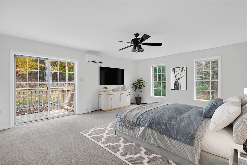 14 Pine Hill Road Framingham, MA 01701 - Photo 22 of 42 a spacious bedroom with a bed and a flat screen tv