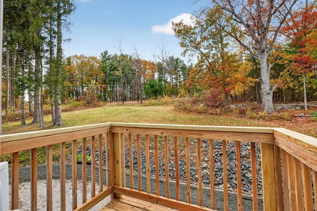 a view of a roof deck with wooden fence