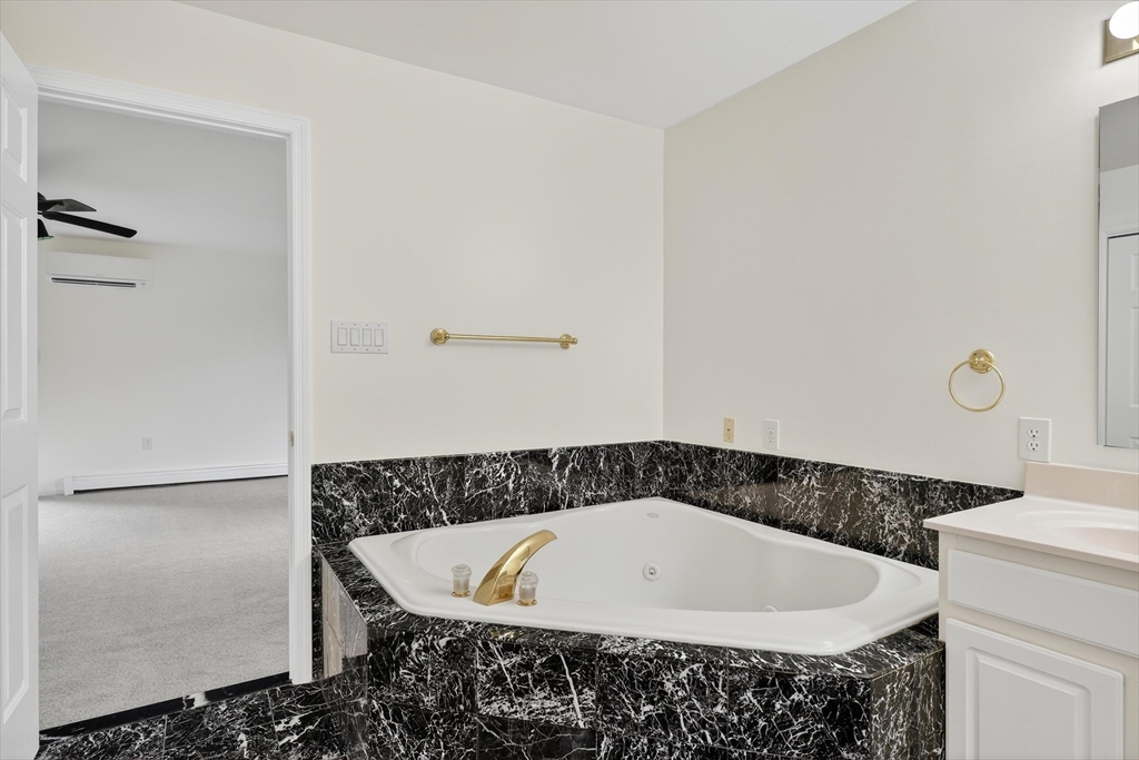 14 Pine Hill Road Framingham, MA 01701 - Photo 27 of 42 a bathroom with a bathtub and shower