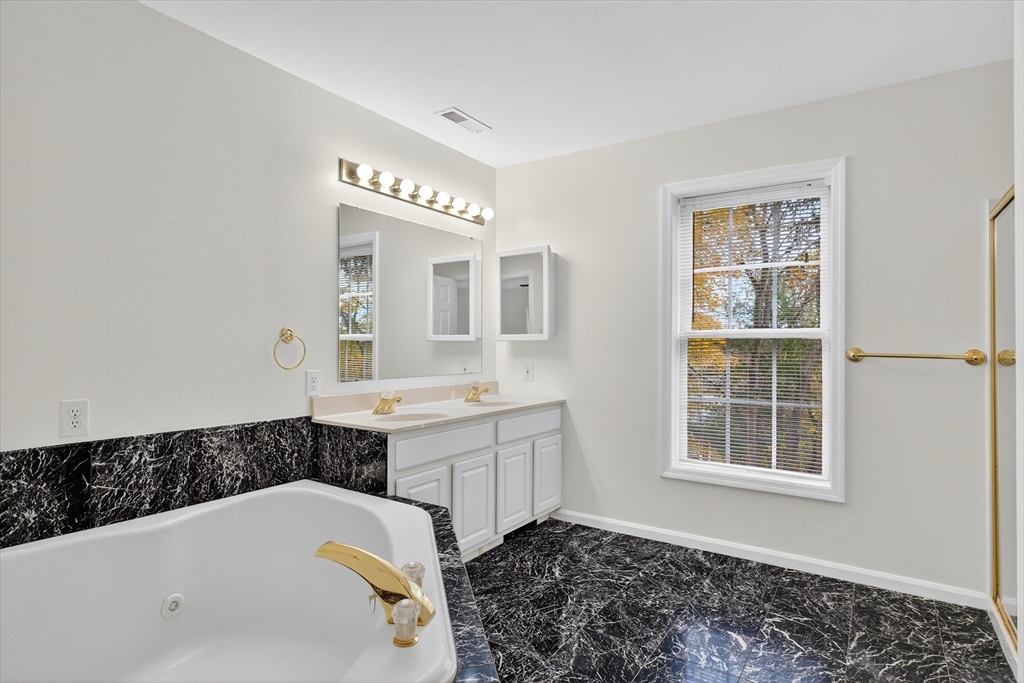 14 Pine Hill Road Framingham, MA 01701 - Photo 28 of 42 a bathroom with a tub sink and a window